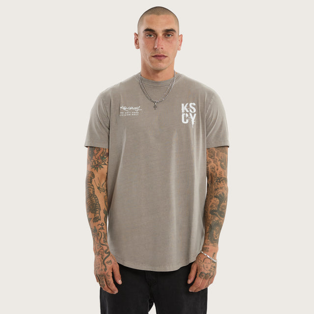 Model wears Alpha Curved Hem Tee Pigment Elephant Grey T-Shirts in Grey - Image 4