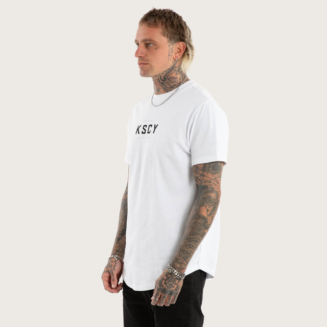 Model wears Stamp Curved Hem Tee in Optical White T-Shirts in White - Image 4