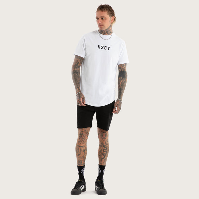 Model wears Stamp Curved Hem Tee in Optical White T-Shirts in White - Image 2