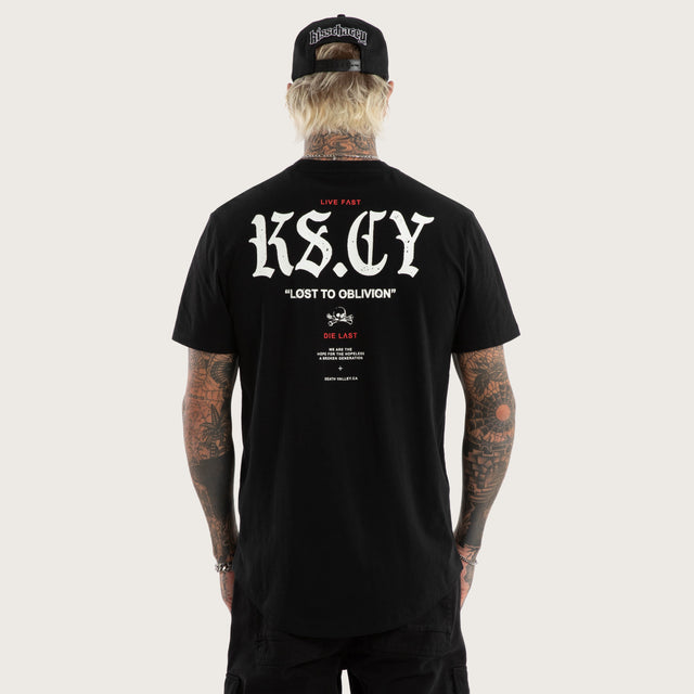 Model wears England Curved Hem Tee Jet Black T-Shirts in Black - Image 1