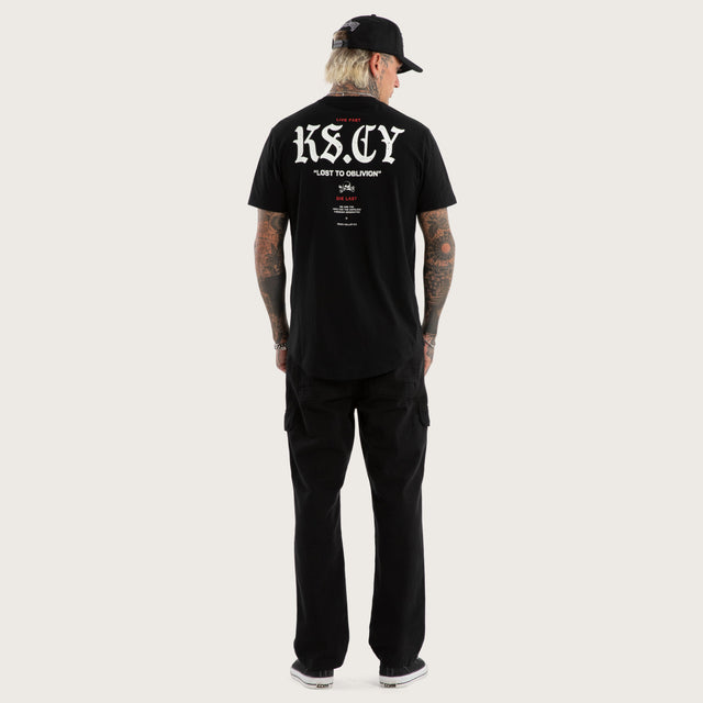 Model wears England Curved Hem Tee Jet Black T-Shirts in Black - Image 5