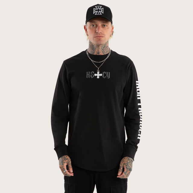 Model wears Tyres Curved Hem Longsleeve Tee Jet Black Longsleeve T-Shirts in Black - Image 3