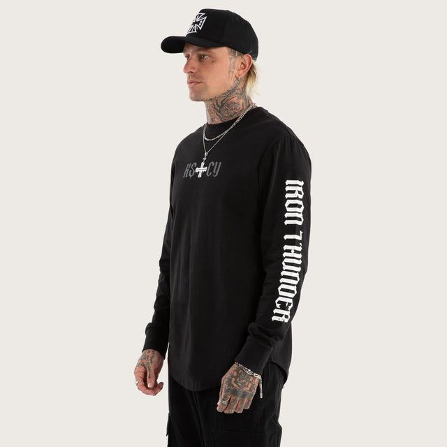 Model wears Tyres Curved Hem Longsleeve Tee Jet Black Longsleeve T-Shirts in Black - Image 4