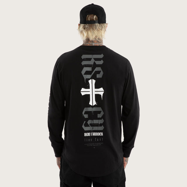 Model wears Tyres Curved Hem Longsleeve Tee Jet Black Longsleeve T-Shirts in Black - Image 1