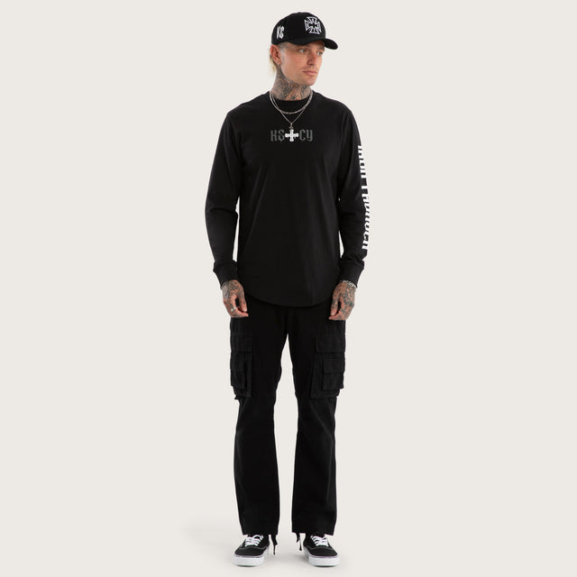 Model wears Tyres Curved Hem Longsleeve Tee Jet Black Longsleeve T-Shirts in Black - Image 2
