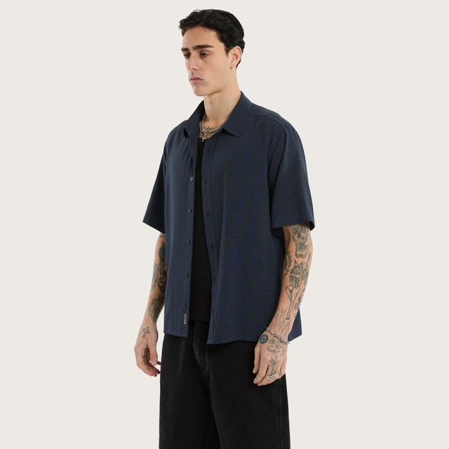 Model wears Longneck Short Sleeve Shirt in Blue Check Short Sleeve Shirts in Blue - Image 3