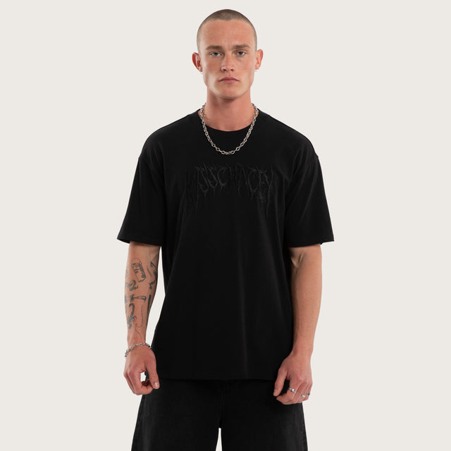 Model wears Mirage Box Fit Tee Jet Black T-Shirts in Black - Image 1