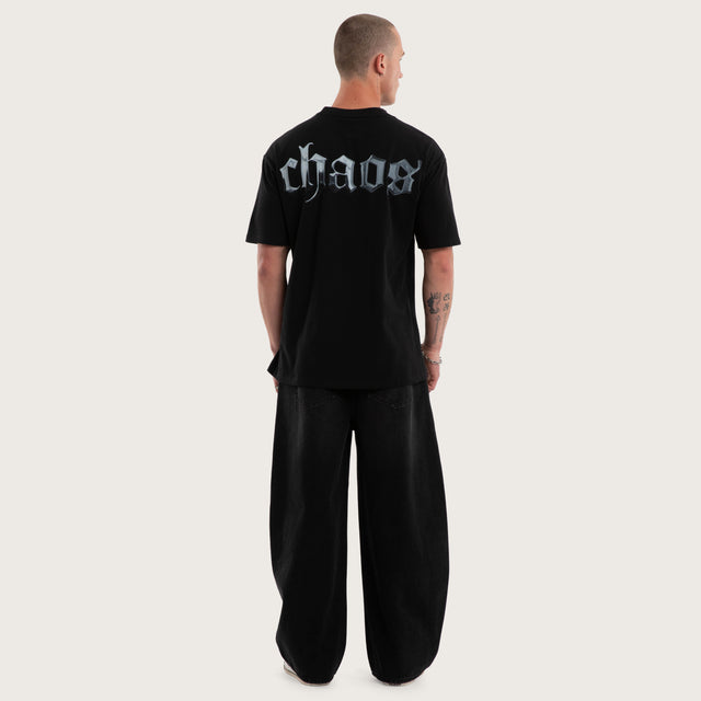 Model wears Mirage Box Fit Tee Jet Black T-Shirts in Black - Image 4