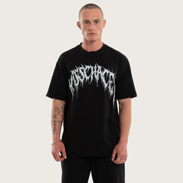 Model wears Utopia Box Fit Tee Jet Black T-Shirts in Black - Image 1