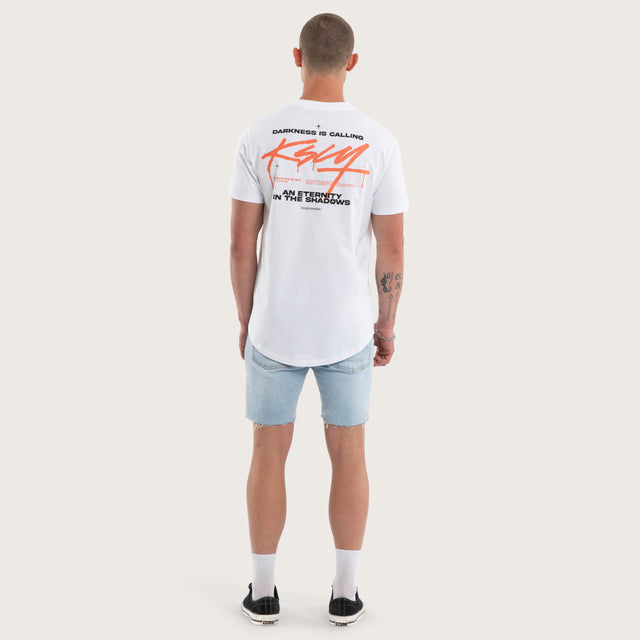 Model wears Prodigy Dual Curved Tee White T-Shirts in White - Image 4