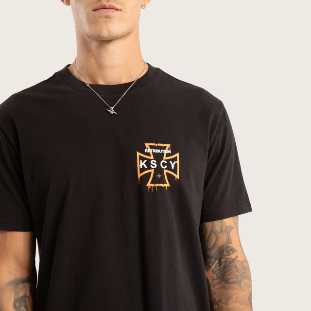 Model wears Retribution Curved Hem Tee Jet Black T-Shirts in Black - Image 3