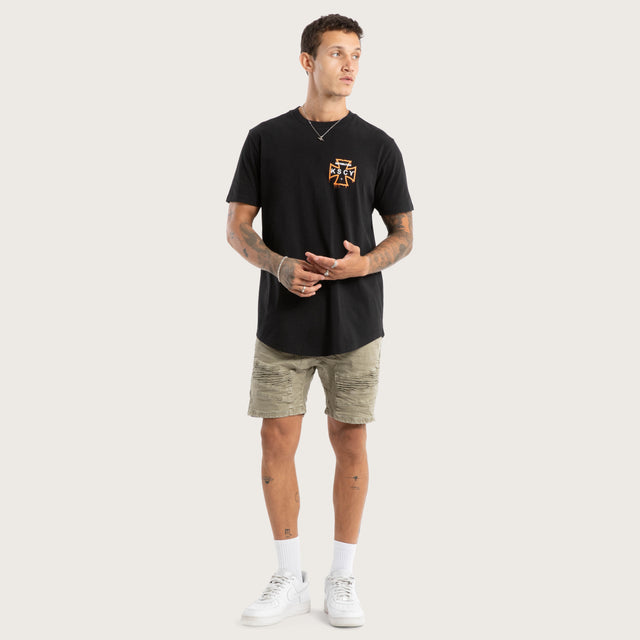 Model wears Retribution Curved Hem Tee Jet Black T-Shirts in Black - Image 4