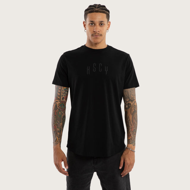 Model wears Trapped Dual Curved Tee Jet Black T-Shirts in Black - Image 1