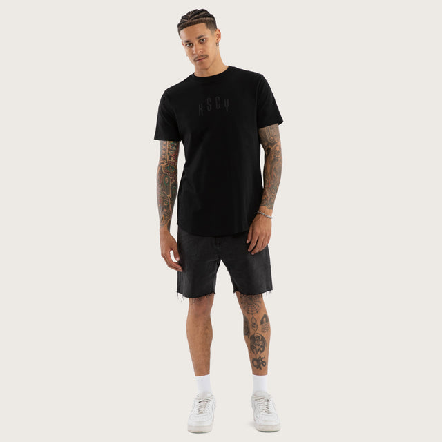 Model wears Trapped Dual Curved Tee Jet Black T-Shirts in Black - Image 5