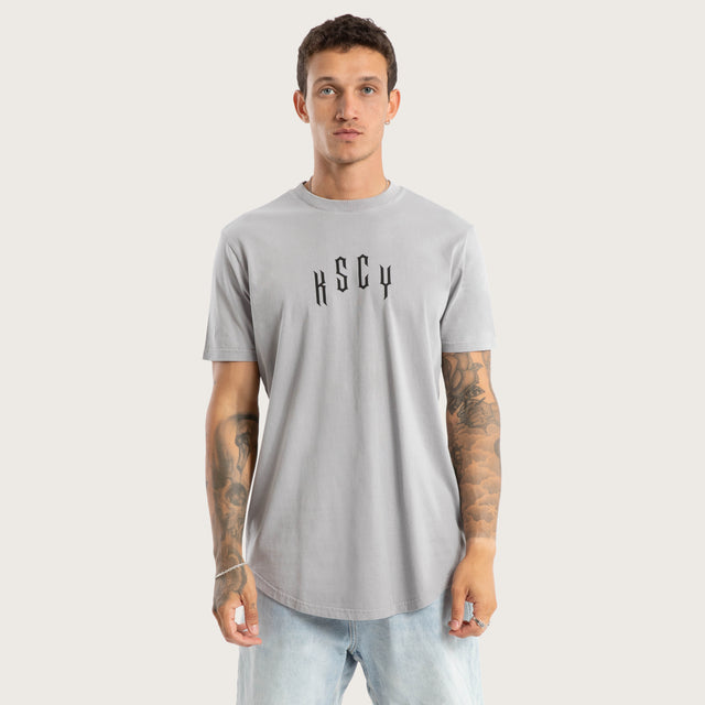 Model wears Trapped Dual Curved Tee Pigment Silver Sconce T-Shirts in Grey - Image 1