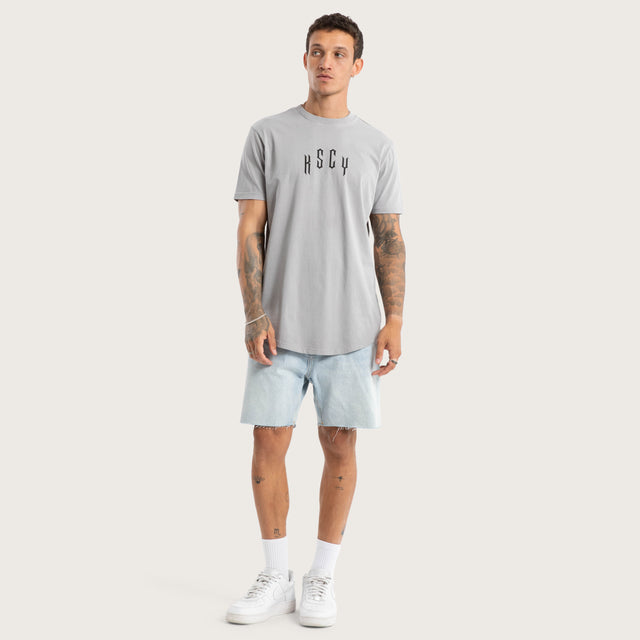 Model wears Trapped Dual Curved Tee Pigment Silver Sconce T-Shirts in Grey - Image 4