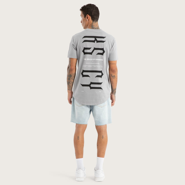 Model wears Trapped Dual Curved Tee Pigment Silver Sconce T-Shirts in Grey - Image 5