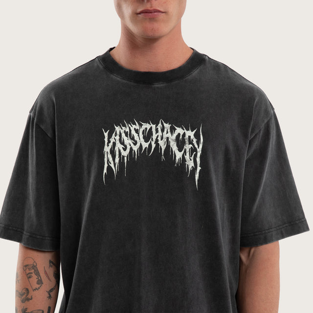 Model wears Cagey Oversized Tee Mineral Black T-Shirts in Black - Image 3