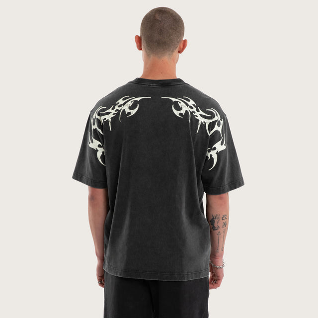 Model wears Cagey Oversized Tee Mineral Black T-Shirts in Black - Image 2