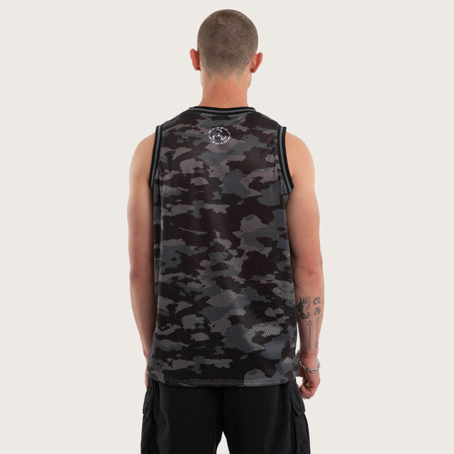 Model wears Glory Basketball Jersey Black Camo Jerseys in Camo - Image 3