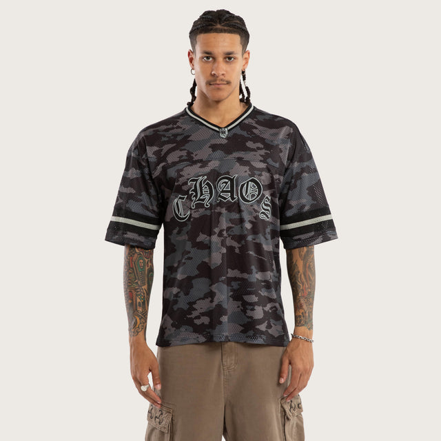 Model wears Pierced Football Jersey Black Camo Jerseys in Camo - Image 1