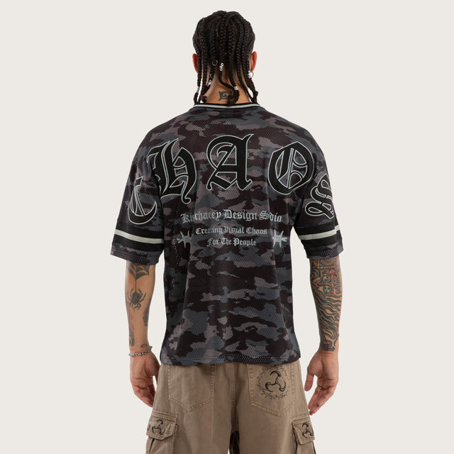 Model wears Pierced Football Jersey Black Camo Jerseys in Camo - Image 2