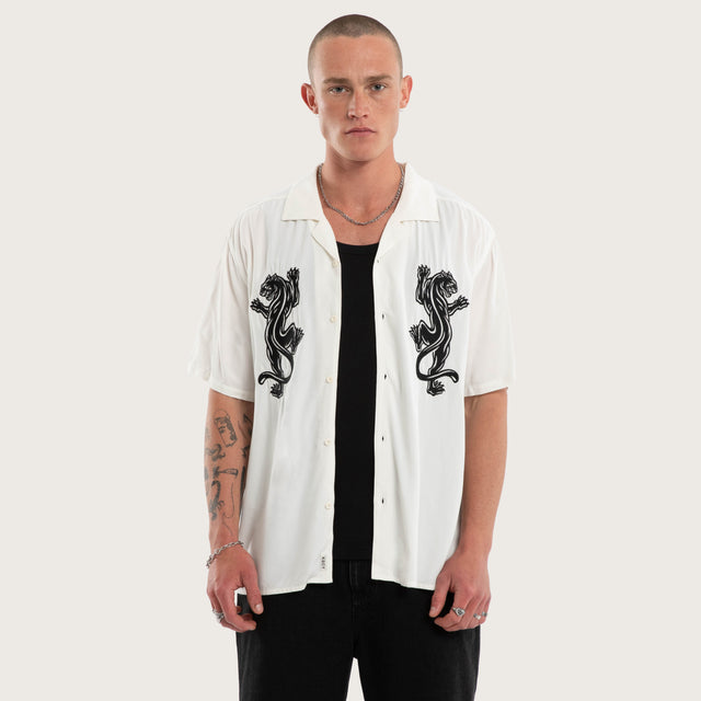 Model wears Risen Button Up Short Sleeve Shirt in Natural White Short Sleeve Shirts in White - Image 1