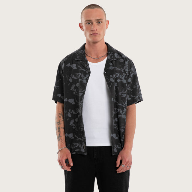 Model wears Thorn Button Up Shirt Black Print Long Sleeve Shirts Black – image 1