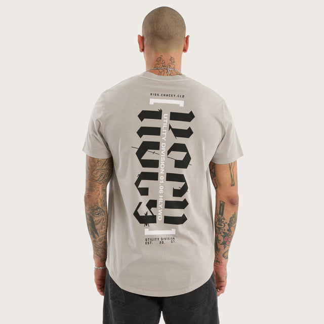 Model wears Sacred Dual Curved Tee Pigment Silver Cloud T-Shirts Grey – image 1