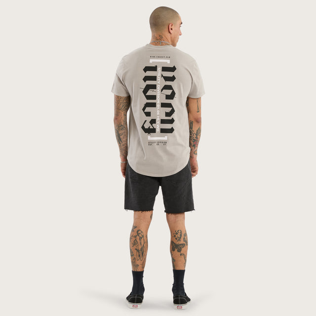 Model wears Sacred Dual Curved Tee Pigment Silver Cloud T-Shirts Grey – image 5