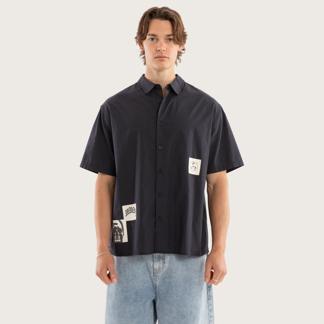 Model wears Ashfall SS Skate Shirt Asphalt Check Short Sleeve Shirts Grey – image 1