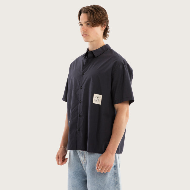 Model wears Ashfall SS Skate Shirt Asphalt Check Short Sleeve Shirts Grey – image 3