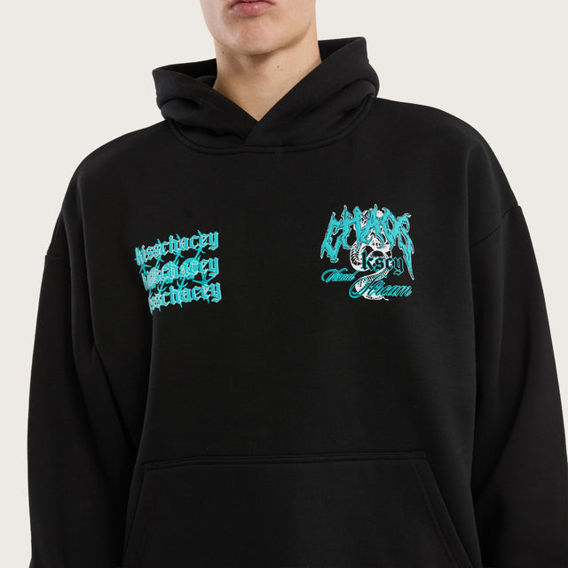 Model wears Agnus Oversized Hoodie Jet Black Hoodies in Black - Image 4