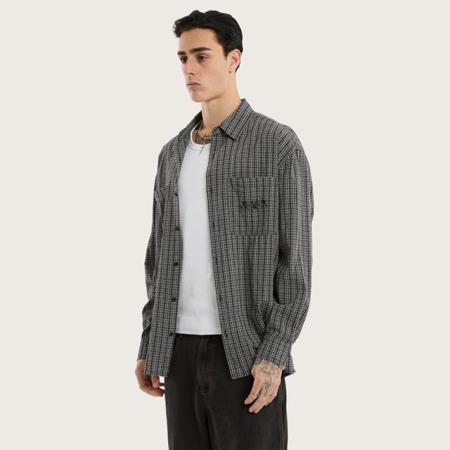 Model wears Devotion Casual Longsleeve Shirt Black Check Long Sleeve Shirts in Black - Image 3