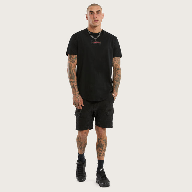 Model wears Apparition Curved Hem Tee Jet Black T-Shirts in Black - Image 5