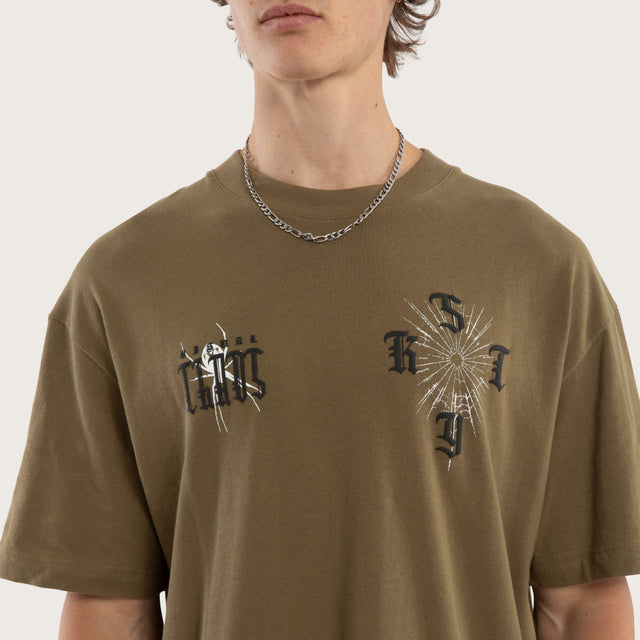 Model wears Anointed Box Fit Tee Military Green T-Shirts in Green - Image 4