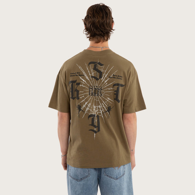 Model wears Anointed Box Fit Tee Military Green T-Shirts in Green - Image 1