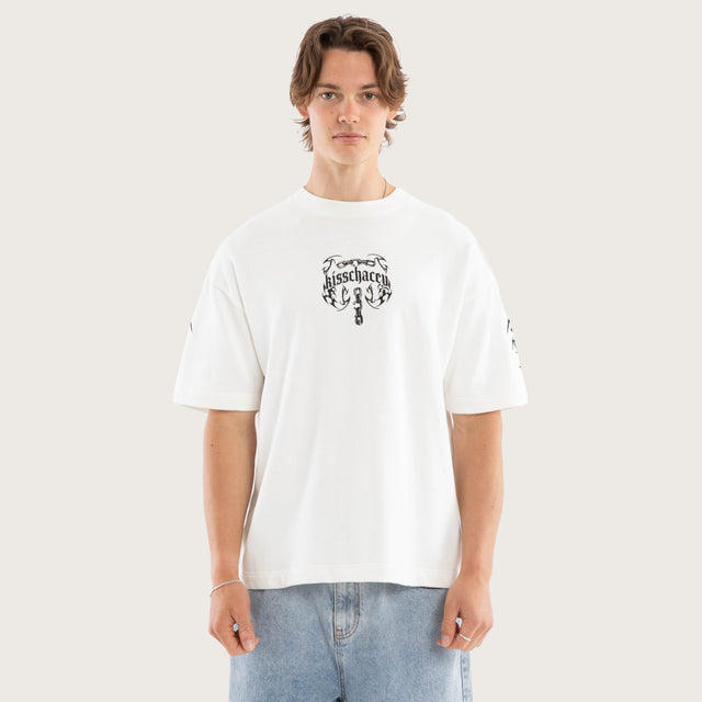 Model wears Chains Loopback Street Tee Natural White T-Shirts in White - Image 4