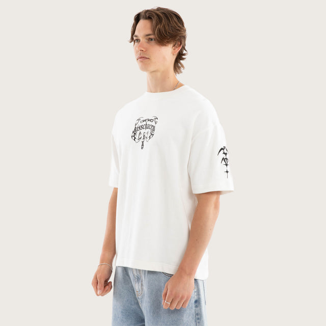 Model wears Chains Loopback Street Tee Natural White T-Shirts in White - Image 5