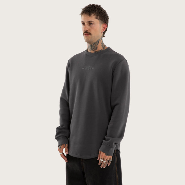 Model wears Insurgence Curved Hem Sweater Grey Jumpers in Grey - Image 4