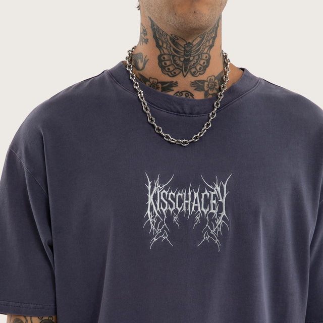 Model wears Revolt Box Fit Tee Snow Mystical T-Shirts in Purple - Image 4