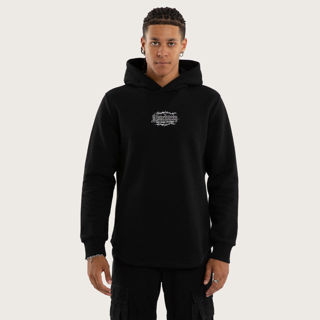 Model wears Risen Curved Hem Hoodie Jet Black Hoodies in Black - Image 1