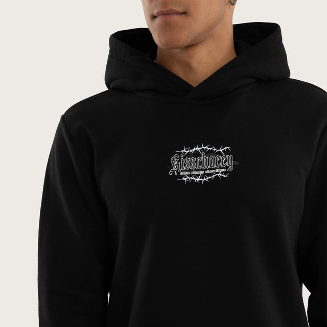 Model wears Risen Curved Hem Hoodie Jet Black Hoodies in Black - Image 3