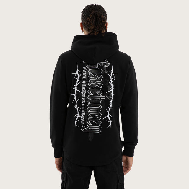 Model wears Risen Curved Hem Hoodie Jet Black Hoodies in Black - Image 4