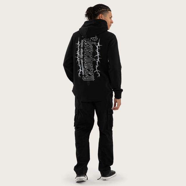 Model wears Risen Curved Hem Hoodie Jet Black Hoodies in Black - Image 5