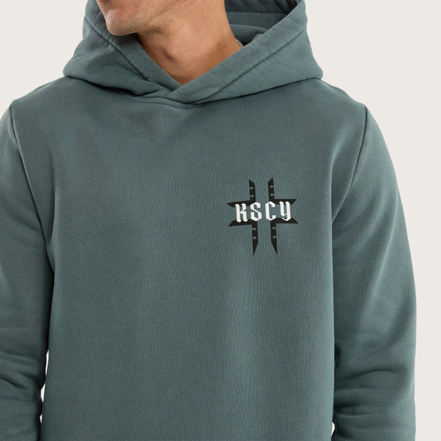 Model wears Catalyst Curved Hem Hoodie Pigment Blue Hoodies in Blue - Image 3