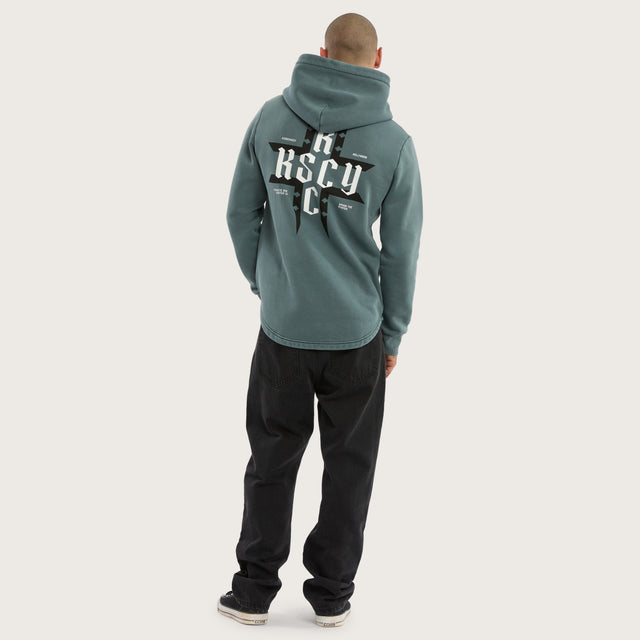 Model wears Catalyst Curved Hem Hoodie Pigment Blue Hoodies in Blue - Image 2