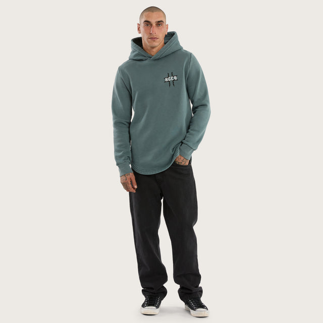 Model wears Catalyst Curved Hem Hoodie Pigment Blue Hoodies in Blue - Image 5