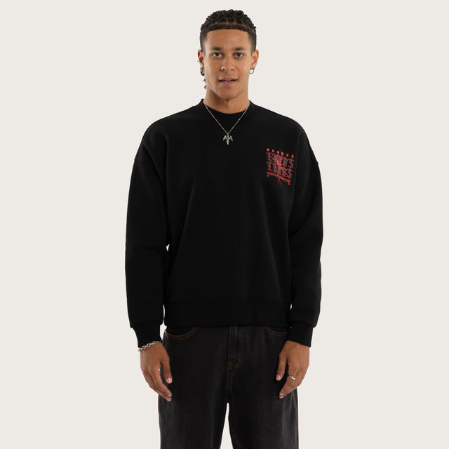 Model wears Protestant Box Fit Sweater Jet Black Jumpers in Black - Image 1