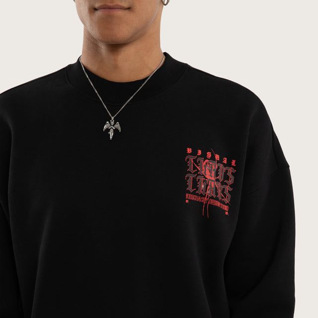 Model wears Protestant Box Fit Sweater Jet Black Jumpers in Black - Image 3